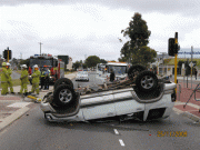 1298951292_car_upside_down_in_accident